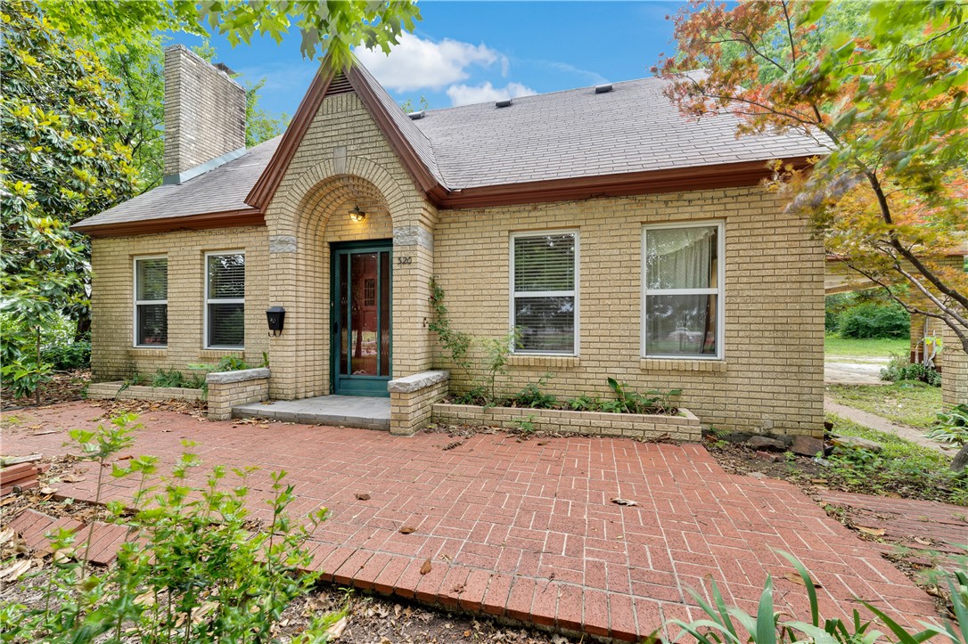 One of kind, custom all-brick home in Springdale, first time on the market since 1948. A 2010 remodel updated the interior, electric, roof and water heater. New HVAC in 2022. The front living area opens to the dining room with extra den. 2-story house with one bedroom and full bath downstairs and 2 bedrooms and half bath upstairs. The brick floors, 2 fireplaces, custom built-ins and multiple patios are some of the features that make this house special. Spacious laundry/mud room plus a pantry and added storage. Large lot with trees, heirloom plantings and shed. Great location within walking distance of the Springdale Library, Murphy Park and the aquatic center and Springdale High School. Washer, dryer and refrigerator convey. Stove does not convey. Selling As-Is, inspection allowed. No SPD.