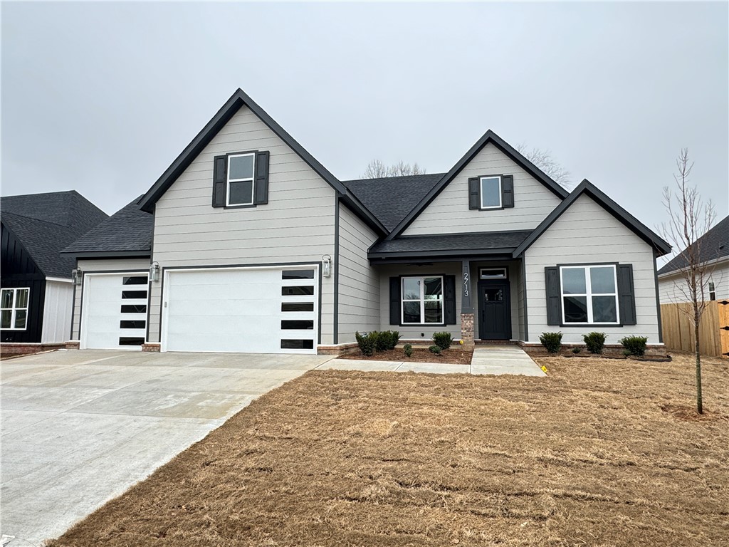 New construction home in desirable area in SW Rogers! It features 4 BR plus bonus room/3 baths/3 car garage. Downstairs has open concept in the living and kitchen area. Kitchen is equipped with gas cook top, built-in oven and microwave, large island, pantry, and eat-in dining. Primary is on main level with a spacious bath and closet. Bedroom 2, 3 and full bathroom are downstairs as well. Upstairs has bedroom 4, a full bath, and/or bonus room.