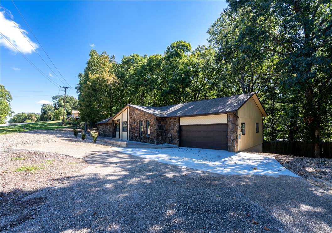Beautifully remodeled home that is centrally located with easy access to everything in Bella Vista. Home features a new roof, cabinets, granite, flooring, master shower, plumbing and electrical fixtures, garage door, deck, privacy fencing and septic system. This home needs nothing.