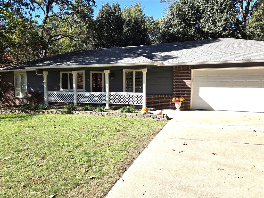 Additional Parcel # 16-03125 .27 acres comes with this home for a total of .60 acres. 3 bed 2 bath cutie, split floorplan. Well maintained home with completely level back yard, .27 additional acres next door also flat. Perfect to build a workshop, 2nd home for family or investment home. Oversized patio in back with main deck fully covered with lights, ceiling fan for many months of enjoyment. Home includes refrigerator, washer, dryer. Propane lines recently added with a gas range for the cook. Granite counters in kitchen, a great open floorplan for family gatherings. Tile floors in most of the rooms, carpet in guest bedrooms only. Extra large garage provides room for 2 cars & extra storage. Home sits on west side close to Lake Loch Lomond, bike trails, Highland Pub, dog park off Glasgow, Lakepoint Restaurant. Not far from Hwy 49 to Bentonville! Septic emptied 2021 new pump installed 2024. Walking distance to Branchwood Rec Center and trails. Cox Cable for Cable. A very special property, perfect for all!