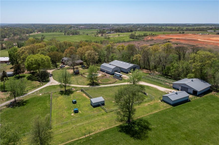 4 MORTON BARNS ON 11.80 ACRES ON BEAUTIFUL HORSE FARM ONLY MINUTES FROM WAL-MART  HEADQUARTERS & XNA.  THIS INCLUDES 4BR/3.5BA, DUTCH COLONIAL STYLE HOME 2 LIVING AREAS, STUDY, LARGE COUNTRY KITCHEN , CRAFT ROOM / 3 MASTER CLOSETS.  LEAF FILTERING SYSTEM LIFETIME WARRANTY TRANSFERABLE, ROOF WARRANTY AND A FULL AMERICAN HOME SHIELD WARRANTY.   INGROU0ND POOL, 36X60 GAMBREL TRAINING BARN WITH 6 12X12 STALLS, WASH RACK, TACK ROOM, OFFICE AND FULL BATH 60X90 FULLY ENCLOSED RIDING ARENA, 60X60 W /5 12X16 STALLS WITH RUBBER MATTS, DUTCH DOORS, FEED ROOM, HAY AND EQUIPMENT STORAGE ,VET STOCKS, 24 X 48 CLIMATE CONTROLLED SHOP, PASTURES ARE FENCED AND CROSS-FENCED WITH TOP OF THE LINE 3 MORTON SHELTERS. LARGE 4 CAR GARAGE HAS WATER EVERY PADDOCKS HAS HOT AND COLD WATER AND ELECTRIC RUN TO EACH ONE OF THEM. AIR EXCHANGE, BIG FANS, FLY SPRAY SYSTEM, AND HUMIDIFIER SYSTEM ALSO. WELL HOUSE COMPLETELY UPGRADED, ALL NEW LINES TO HOUSE HAVE BEEN UPGRADED. HOUSE INTERIOR NEW PAINT. HEAT & AC SERVICED YEARLY. ASK CHARLA ABOUT EQUIP