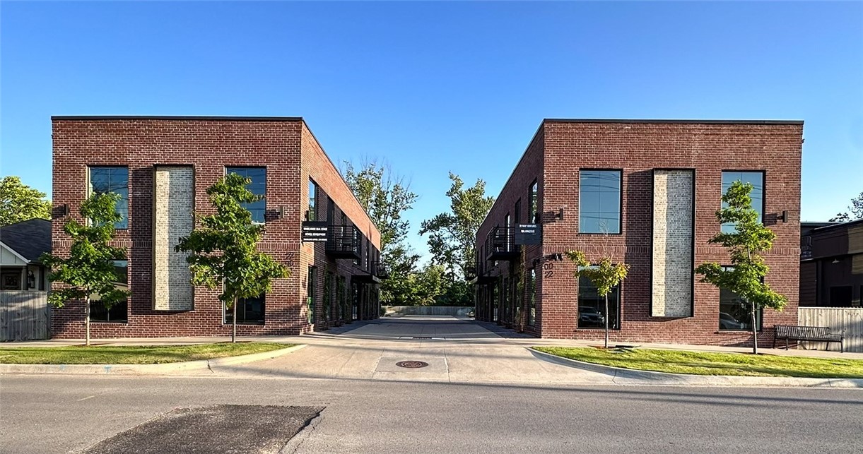 This modern office/retail space, located in downtown Bentonville, is within walking distance of the new Walmart Home Office campus, local coffee shops, restaurants, The Momentary, 8th Street Market, and downtown trails. Featuring open floor plans, a shower, kitchenette, abundant natural light, outdoor space, and bike storage, the property offers convenience and contemporary amenities. Additional features include security cameras installed outside and in stairwells. Financials available upon request. Fully occupied. Seller willing to consider a full or partial 12-month leaseback.