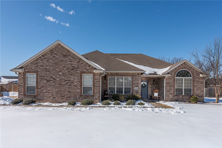 Welcome home to this 3-bedrm, 2-bath home located min from local schools, downtown Prairie Grove, Farmington, & 6 mi from I-49 in Fayetteville. From the covered entry, head inside to open-concept layout feat spacious living room with crown molding, tray ceiling, corner gas-log fireplace, & stained concrete floors. The eat-in breakfast nook flows into a well-appointed kitchen with abundant cabinetry, granite countertops, bar-height peninsula, & stainless-steel appliances. Formal dining room with coffered ceiling details sits just off the kitchen & living area, perfect for hosting gatherings! Large & inviting primary suite includes a private ensuite with a walk-in shower, jacuzzi tub, dual-sink vanity, & linen storage. Two more bedrms & full bathrm, provide flexible space for guests, family, or a home office. Out back, enjoy a covered patio & custom stone fire pit overlooking the large fully fenced backyard! UPDATES: New Roof (Jan 2026) New HVAC (Dec 2025), New Dishwasher (Sept 2025), New Hot Water Heater (Jan 2022)