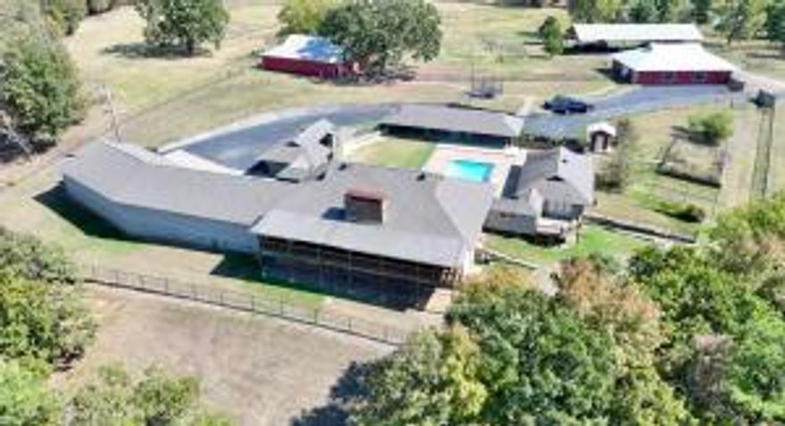 Stunning River Valley Retreat on 70+ Acres! Discover this sprawling 6,676 sq ft estate, perfectly situated on over 70 acres. This remarkable property features:4 Spacious Bedrooms: Enjoy comfort and privacy with generously sized bedrooms, each designed with it's own private bath.Equestrian Amenities: A 7-stall horse barn with a wash bay caters to equestrian enthusiasts. Perfectly designed for functionality and ease of care.Expansive Pole Barn: Additional storage and workspace in a versatile 40x100 pole barn, ideal for hobbies, equipment, or vehicles.Well-maintained pipe fencing. Indoor safe room. HOUSE SOLD ''AS IS''