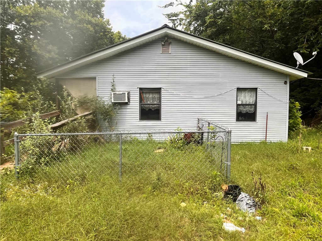 Investment opportunity! This home sits on over 4 acres in the Ozark foothills.
Property sold As-is where-is with no disclosure provided. Prior to showing approval, buyers and agents must sign the hold harmless agreement located in the documents section.