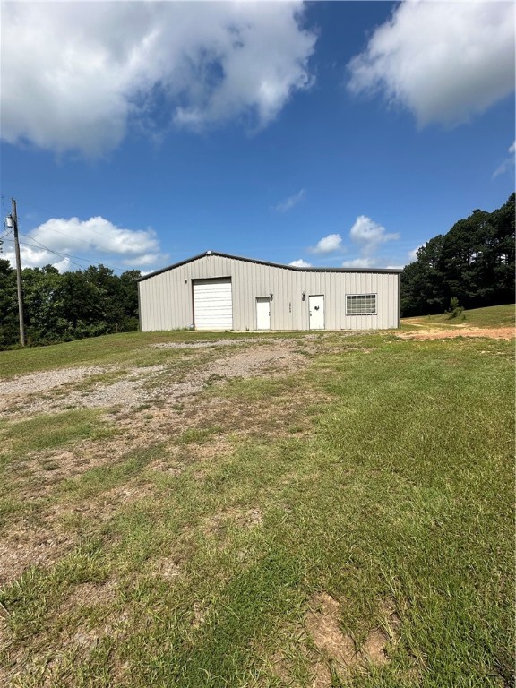 Building is being used by a non-profit at this time, all equipment, tools, wood belong to them and not seller and do not convey. Discover the perfect space for your next project or business venture on this 1.69 acre property designed with flexibility and functionality in mind. The centerpiece is a well-built 2800 sq ft metal shop, featuring concrete floors, foam-insulated walls, and a 20x20 climate-controlled office with a mini-split system, ideal for working year round. With electricity already connected, it's ready for tools, equipment, or even a home-based business setup. Tucked just behind the main shop is a spacious 40x60 pole barn, also foam-insulated, offering substantial covered storage or potential for future development. While it currently lacks electricity and garage doors it provides a clean slat to customize. Whether you're a contractor, craftsman, or entrepreneur in need of workspace or simply someone looking for a property with utility, this setup delivers space, structure andāāāāāāāāāāāāāāāāāāāāāāāāāāāāāāāā potential.