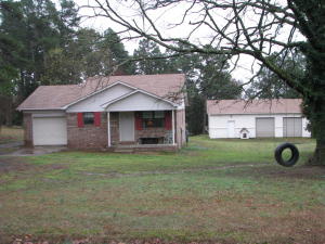 Large SHOP! New ROOF! Nestled on a quiet private street, on almost an acre. New laminate flooring, paint & hot water heater! This home is in excellent condition, cozy and clean! Front porch back deck. Perfect home with remodeled kitchen and huge 30 by 40 shop will give everyone something to be excited about!