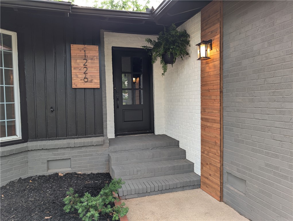 : Beautifully remodeled home in the Eastern Hills subdivision! This home boasts four bedrooms, two bathrooms, dining room/den with wood burning fireplace, walk-in pantry. It has an additional bonus room that can be used as an office. The fourth bedroom is located on the lower level and can be used as recreational space that opens to the large, fenced yard. Master suite has a walk-in closet, walk-in shower and Jacuzzi tub, as well as a separate HVAC system. There are two sets of laundry connections, one in the bonus room and the other in the double garage. Deck on the upper level overlooks the water and the lower level opens to a large patio leading to the garden with raised beds and a greenhouse! Mature pecan and oak trees complete this home. Minutes to 540, University of Arkansas, shopping, downtown, and so much more!