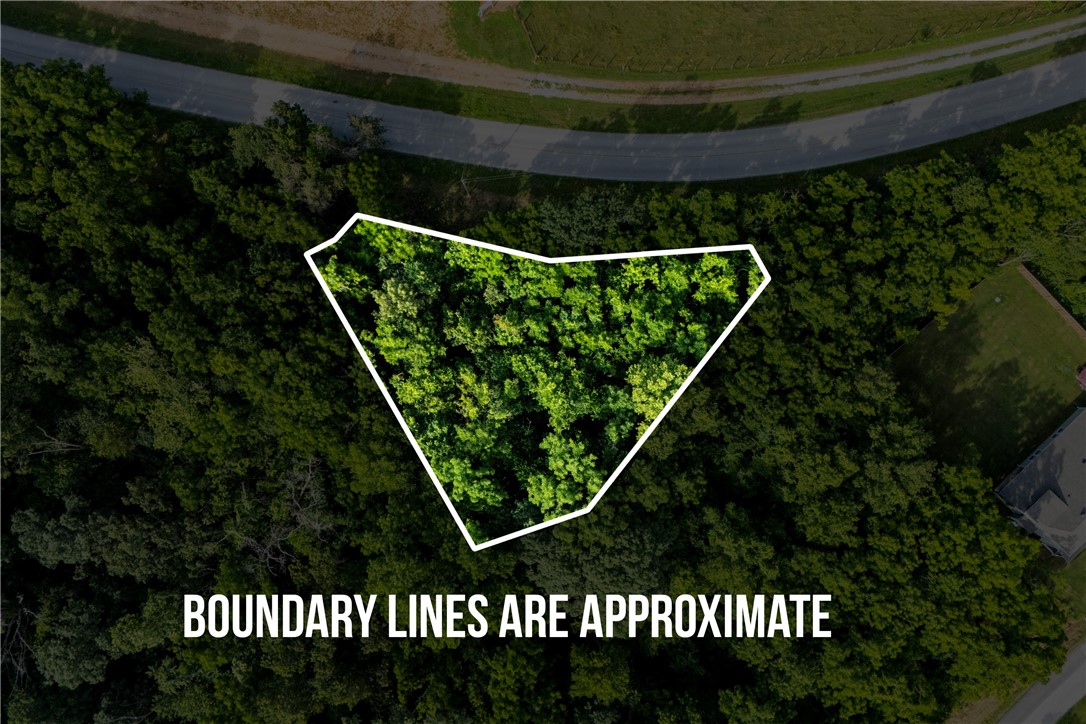 This spacious lot in Bella Vista offers an opportunity to build your dream home or investment property. A perk test and septic plan for a 4-bedroom system were completed in 2019, giving you a head start on the building process. Located just 0.7 miles from the 3.6-mile Tunnel Vision Trail on the Little Sugar Trail System, it's a solid spot for anyone who wants quick access to biking and nature.