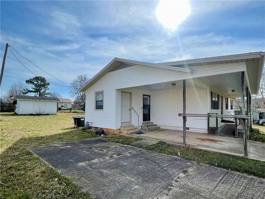 Experience the best of small-town living in this charming 3 bedroom, 2 bathroom home, built in 1991. With 1497 square feet of living space, the property features a versatile (flex) room off the kitchen. Enjoy easy access to town amenities, including a walking trail and splash pad just a short stroll away. Extensive storage options include a 600 square foot basement/cellar with outside entrance only, 10x16 outbuilding, and carport storage room. Conveniently located approximately 30 minutes from Fayetteville and Springdale, AR. Utility availability is the responsibility of the buyer or buyers agent.