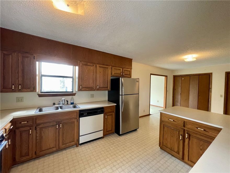 Experience the best of small-town living in this charming 3 bedroom, 2 bathroom home, built in 1991. With 1497 square feet of living space, the property features a versatile (flex) room off the kitchen. Enjoy easy access to town amenities, including a walking trail and splash pad just a short stroll away. Extensive storage options include a 600 square foot basement/cellar with outside entrance only, 10x16 outbuilding, and carport storage room. Conveniently located approximately 30 minutes from Fayetteville and Springdale, AR. Utility availability is the responsibility of the buyer or buyers agent.