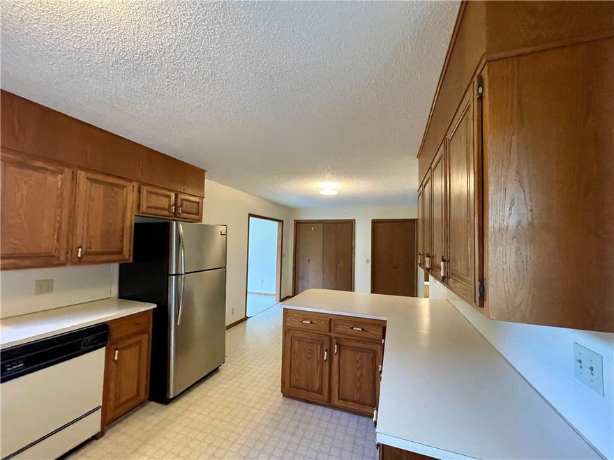 Experience the best of small-town living in this charming 3 bedroom, 2 bathroom home, built in 1991. With 1497 square feet of living space, the property features a versatile (flex) room off the kitchen. Enjoy easy access to town amenities, including a walking trail and splash pad just a short stroll away. Extensive storage options include a 600 square foot basement/cellar with outside entrance only, 10x16 outbuilding, and carport storage room. Conveniently located approximately 30 minutes from Fayetteville and Springdale, AR. Utility availability is the responsibility of the buyer or buyers agent.