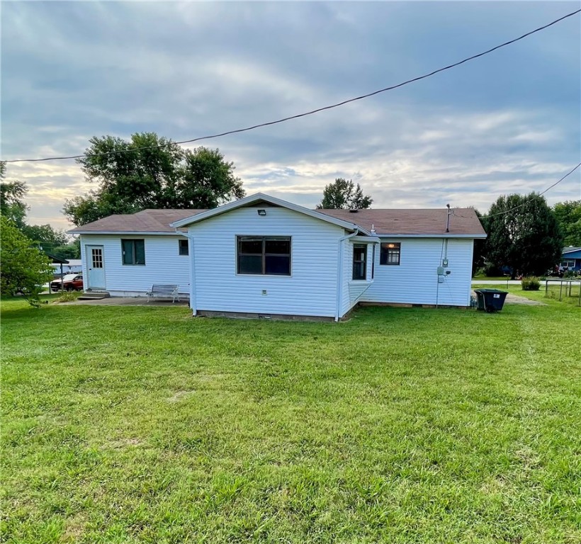 Experience the best of small-town living in this charming 3 bedroom, 2 bathroom home, built in 1991. With 1497 square feet of living space, the property features a versatile (flex) room off the kitchen. Enjoy easy access to town amenities, including a walking trail and splash pad just a short stroll away. Extensive storage options include a 600 square foot basement/cellar with outside entrance only, 10x16 outbuilding, and carport storage room. Sold as-is, with no repairs. Conveniently located approximately 30 minutes from Fayetteville and Springdale, AR.
