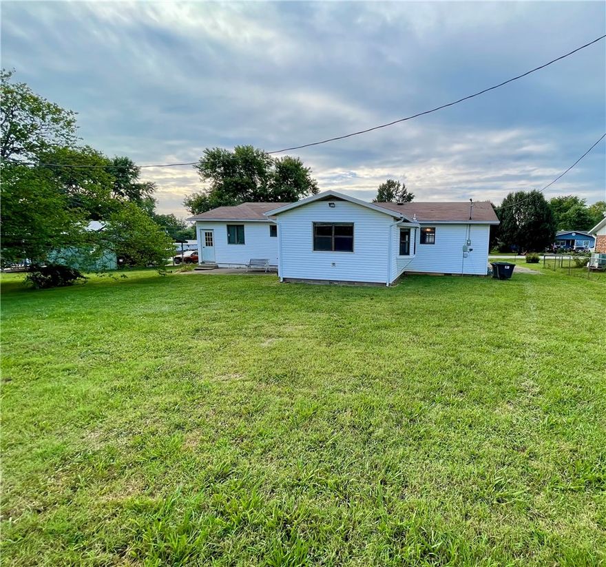 Experience the best of small-town living in this charming 3 bedroom, 2 bathroom home, built in 1991. With 1497 square feet of living space, the property features a versatile (flex) room off the kitchen. Enjoy easy access to town amenities, including a walking trail and splash pad just a short stroll away. Extensive storage options include a 600 square foot basement/cellar with outside entrance only, 10x16 outbuilding, and carport storage room. Conveniently located approximately 30 minutes from Fayetteville and Springdale, AR. Utility availability is the responsibility of the buyer or buyers agent.