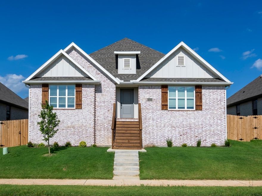 Charming and move-in ready. This well designed home features a light brick exterior, inviting front steps, and a fully fenced yard. Inside, enjoy the seamless flow of an open concept living area with wood-look tile flooring, tray ceiling, and a cozy gas fireplace. The modern kitchen boasts granite countertops, a spacious island with pendant lighting, stainless steel appliances, and a pantry. The primary suite offers comfort and style with a tray ceiling, plush carpet, and a spa-like en-suite featuring a large tiled shower and double vanities. Additional highlights include a two-car rear-entry garage, covered side porch, and low-maintenance landscaping. Located in a desirable neighborhood with a smart, functional layout that fits a variety of lifestyles.