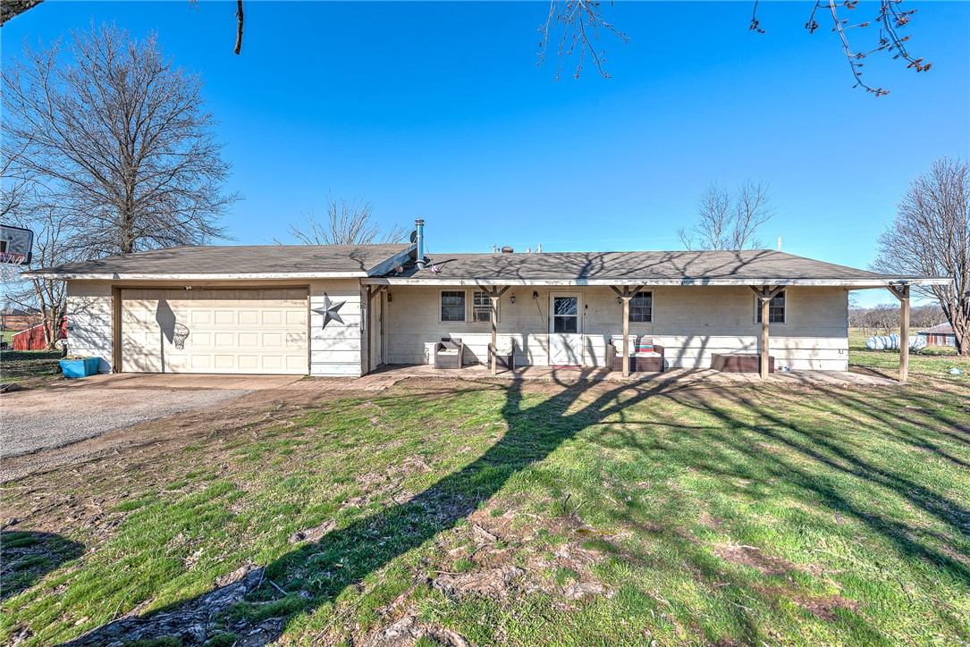 Tons of potential with this large Multi-structure lot in a growing area! Zoned Bentonville schools ! This land has two structures on it, a home currently tenant occupied and a vacant mobile home. Homes and land are sold as is, where is. Don’t miss out on the chance to own flat land in this thriving/growing area!