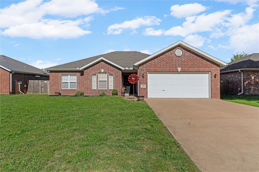 Welcome to your gorgeous next home in the highly sought-after Windwood Subdivision! The heart of this home is an inviting, light-filled living area anchored by a cozy gas-log fireplace.
Designed with everyday living in mind, the desirable split-bedroom floor plan ensures ultimate privacy. The secondary bedrooms are generously sized, while the luxurious primary suite serves as a true retreat. It features dual closets and a spa-like primary bathroom with separate vanities, a relaxing jetted tub and a walk-in shower. A dedicated laundry room keeps daily chores neatly tucked away.
Step outside to your private, fully fenced backyard and patio—an ideal spot for weekend BBQs, morning coffee, or unwinding after a busy day. Location is everything, and this turnkey gem perfectly positions you just minutes from the vibrant Bentonville Square, fantastic local amenities, and world-class trails! Schedule your showing today before this beauty is gone!