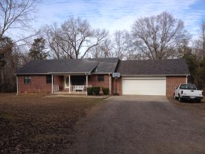 Custom built one owner home situated on 2 acres. Living with high ceilings. Large kitchen with cabinets galore. 3 bedroom, two bath. Nice laundry and large double garage. Deck and fenced yard.