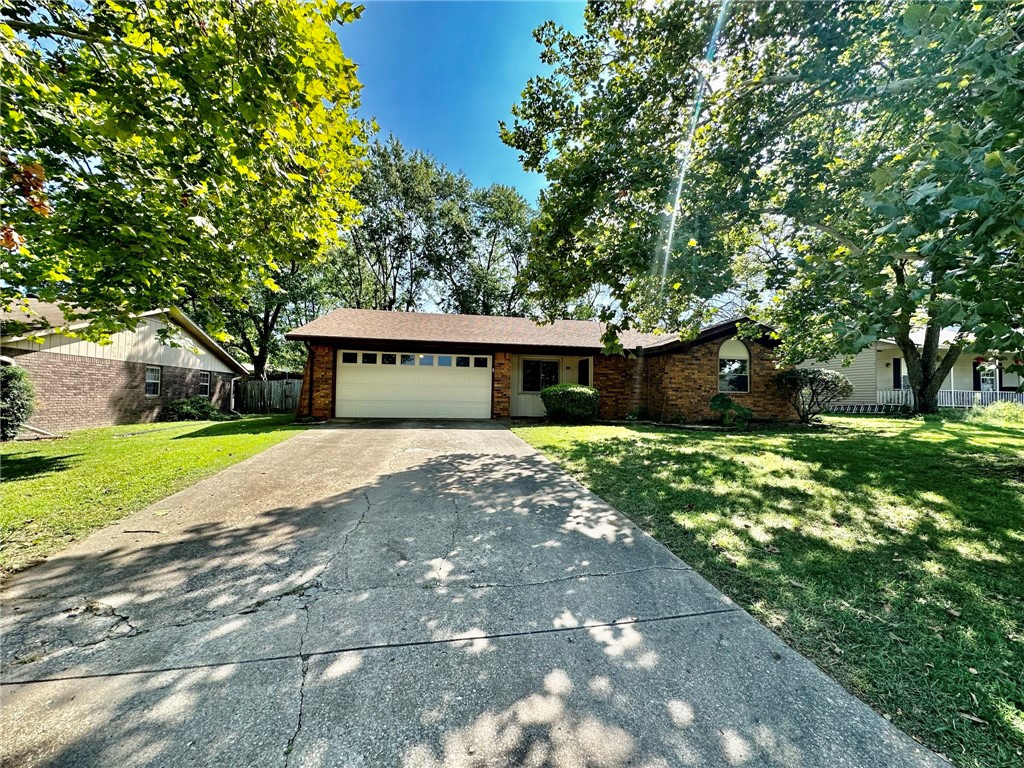 Great 3 bed, 2 bath home with two living areas and large fenced yard in established Rogers neighborhood. Fantastic, central location close to schools, public library, shopping, ect. New flooring in front living room and bedrooms. Attached 2 car garage, covered front porch. Come call this home!