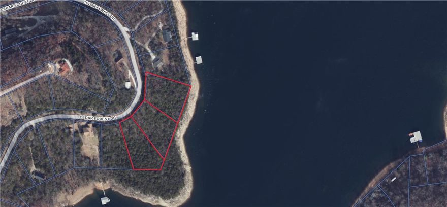 Your perfect slice of Beaver Lake life awaits YOU on the North end near Point 4!  This 1.06 acre Lot nestled in the peaceful surroundings of Cedar Forest Subdivision is a gently sloping, wooded parcel offering the perfect blend of privacy and natural beauty, making it ideal for a custom home, vacation retreat or investment opportunity.    This plat offers seclusion with breathtaking panoramic views  located close to shore for an easy walk to the water and is an ideal canvas for your dream home with generous land to store your RV, water toys, and even plant your own homegrown garden.  Paved road access  Cedar Forest is minutes to Lost Bridge Village, Marina and all the amenities.   There is an  airstrip minutes away or take a short drive to Bentonville, Rogers or Eureka Springs, for  dining, shopping and entertainment while still enjoying a quiet lake lifestyle.  Rare opportunity to own over an acre on the shore line   Perc test has been completed