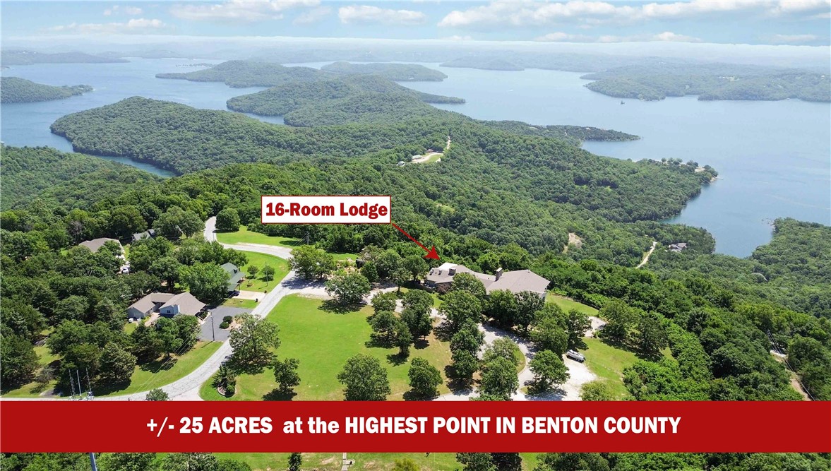 Discover this incredible +/- 25-acre property with breathtaking, year-round views of Beaver Lake from Benton County's highest point at 1,800 feet. Overlooking 487 miles of shoreline, this is the only redevelopment site with sewer access, making it a rare opportunity for investors. Potential include resort, hotel, retreat center, condos, apartments, or mixed-use development. Conveniently located just 1.7 miles East of Lost Bridge Marina, 2.7 miles West of Beaver Lake Sail Club. It is also only a 20 minute drive to the Rogers Executive Airport and only a 35 minute drive to the new Walmart World Headquarters. This property is arguably the best view between the Rockies and Appalachians. Don't miss out on the opportunity to own this stunning location that combines natural beauty with unmatched redevelopment potential.