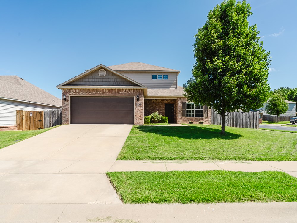Charming 3-bedroom, 2.5-bath home located on a spacious corner lot in Lakewood Crossing. This well-maintained two-story offers an open-concept layout with abundant natural light, a welcoming living area, and a functional kitchen with plenty of cabinet space. The primary suite is conveniently located on the main floor, featuring an en-suite bath and walk-in closet, while two additional bedrooms are situated upstairs for added privacy. Zoned for Janie Darr Elementary, Elmwood Middle, and Rogers High School, this home is perfect for families seeking access to top-rated schools. The fully fenced backyard with a patio is ideal for outdoor entertaining or relaxing evenings. Additional features include a 2-car garage, low-maintenance exterior, and great curb appeal. Conveniently located just minutes from I-49, shopping, and dining, this home offers the perfect blend of comfort, location, and value in one of Lowell’s most desirable communities.