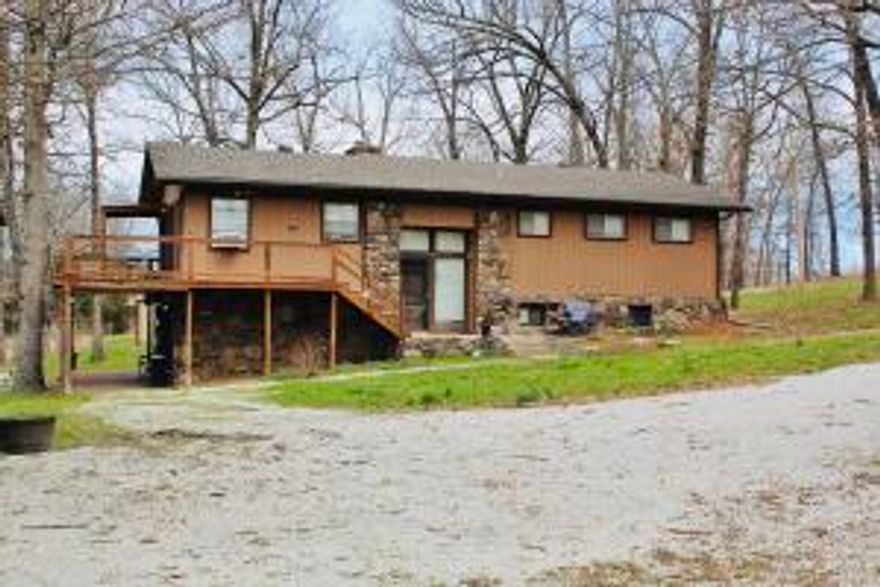 Country living on 4 acres in Harrison school district! This peaceful 5 BR 3 BA home has so much to offer!  Basement has a large den, wood stove, hot tub stays and a large walk out patio and deck with fire pit.  Surrounded by mature, shade trees and wildlife! 20x30 shop building with concrete floor and electricity, pasture is fenced and cross fenced and has 2 additional storage buildings. Perfect for a nice hobby farm and garden.  30 AMP for RV on pad.  Paved road frontage with 3 driveways into the property.