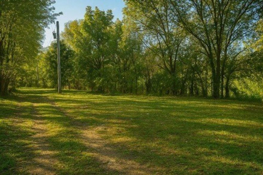 2.87 Acres Inside Gravette City Limits - Rare In-Town Acreage with Utilities & Build Potential
Welcome to your blank canvas just minutes from Gravette’s heart! This 2.87-acre parcel lies inside city limits, with electric already onsite, city water access at the road, fiber internet availability, plus an existing well & pond. The property features a 3-bed, 2-bath manufactured home (sold as-is, not on permanent foundation), a septic system likely needing replacement, and remnants of old foundations suggest multiple possible building sites. Gentle terrain, partial woodland, and open space offer flexibility for homesteads, small builds, or phased development. Located for convenience, a short drive to Gravette’s amenities (parks, trails, splash park) and easy access to regional hubs in Northwest Arkansas.