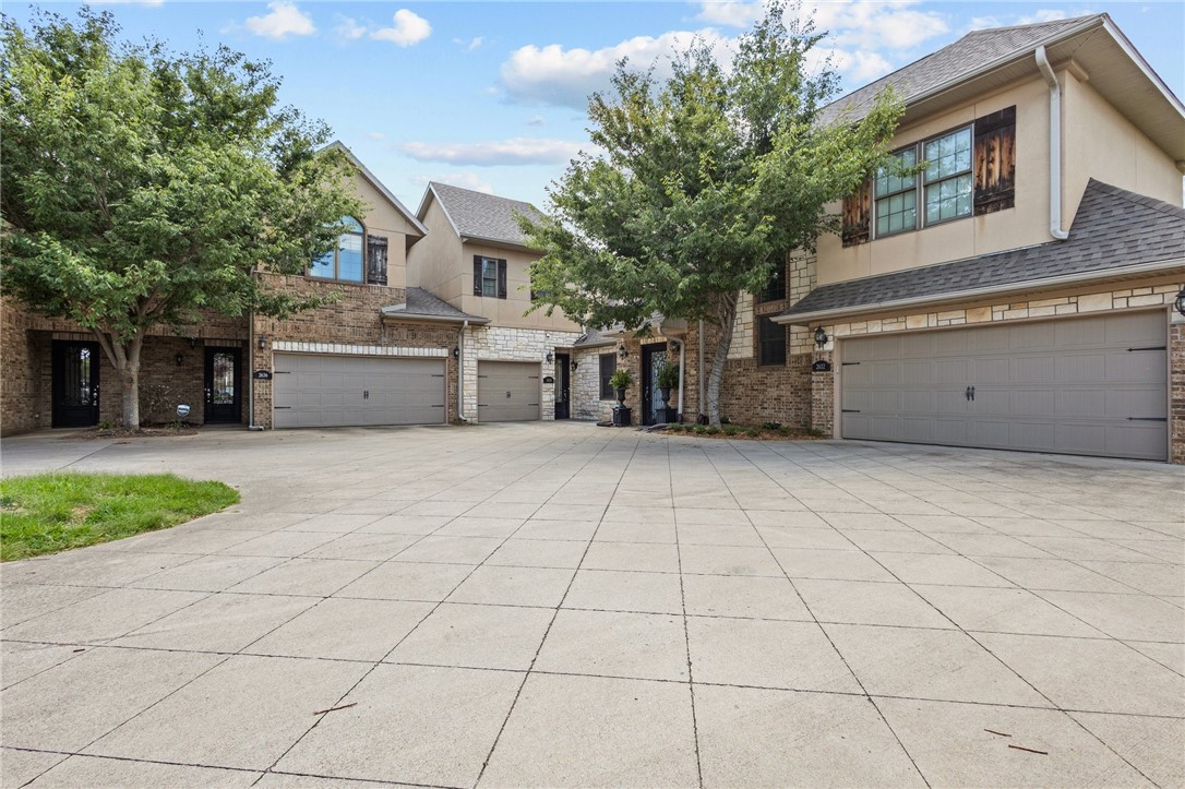 Introducing a stunning new listing in the heart of Pinnacle Hills Promenade! This elegant 2-bedroom, 2.5-bathroom residence offers luxurious, maintenance-free living with exquisite crown molding and soaring 10-foot ceilings. Designed for comfort and style, this home boasts spacious living areas and modern finishes. Enjoy the convenience of a prime location with easy access to shopping, dining, and entertainment. This gem combines sophistication and ease, making it the perfect sanctuary for those seeking an upscale urban lifestyle. Don't miss out on this exceptional opportunity to own a piece of property near the Pinnacle Hills Promenade!