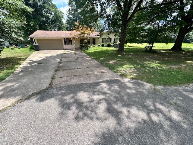 Quite comfortable 3 BR 1 BA home on dead end street. Home exterior features include a covered front porch, screened in back porch and a 16 X 16 storage shed with lean-too on a chain link fenced back yard.
Interior features a large open Living/Dining area with newer floor coverings and plenty of room for large gatherings. kitchen has nice cabinets with an island bar. Bathroom features a newer large walk-in shower with seat and railing. Enjoy sitting around the gas fireplace in the winter months or sit out in the screened-in back porch during the warmer seasons. This property has much to offer for under 150,000.