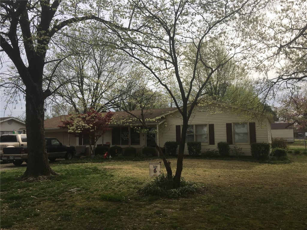 Quite comfortable 3 BR 1 BA home on dead end street. Home exterior features include a covered front porch, screened in back porch and a 16 X 16 storage shed with lean-too on a chain link fenced back yard.
Interior features a large open Living/Dining area with newer floor coverings and plenty of room for large gatherings. kitchen has nice cabinets with an island bar. Bathroom features a newer large walk-in shower with seat and railing. Enjoy sitting around the gas fireplace in the winter months or sit out in the screened-in back porch during the warmer seasons. This property has much to offer for under 150,000.