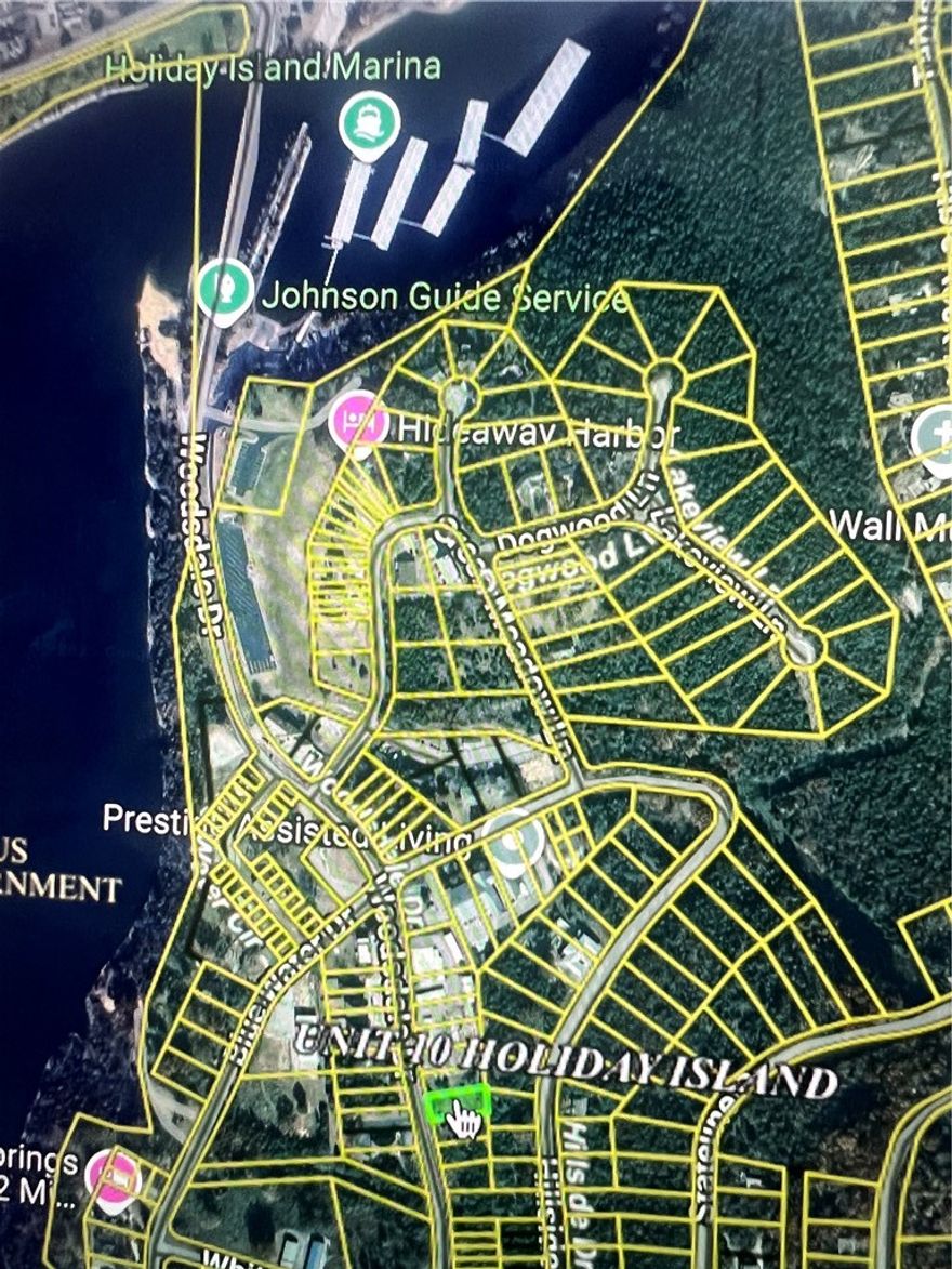 Flat Commercial Lot .4 Miles from Holiday Island Marina! Excellent Lot on the Island of Table Rock Lake with Main Road Frontage!! All Utilities at the street.  From Watersport Rentals, Boat Sales and Maintenance to IceCream Shop, endless opportunity with this one.  Owner Financing available and Contractor Concierge Service provided to get your idea through the permitting process so you can stay focused on your new business.  Leatherwood Trail and Holiday Island Beach and Kayak Park across the street!  This sleepy town is waking up and has never been easier to build than now. 2 Swimming Pools, Pickle Ball, Shuffle Board and 1 of 2 Golf Courses all within walking distance, ~1 mile.  Holiday island offers Resort Recreation Lifestyle Living and is a true Gem of the Ozarks.