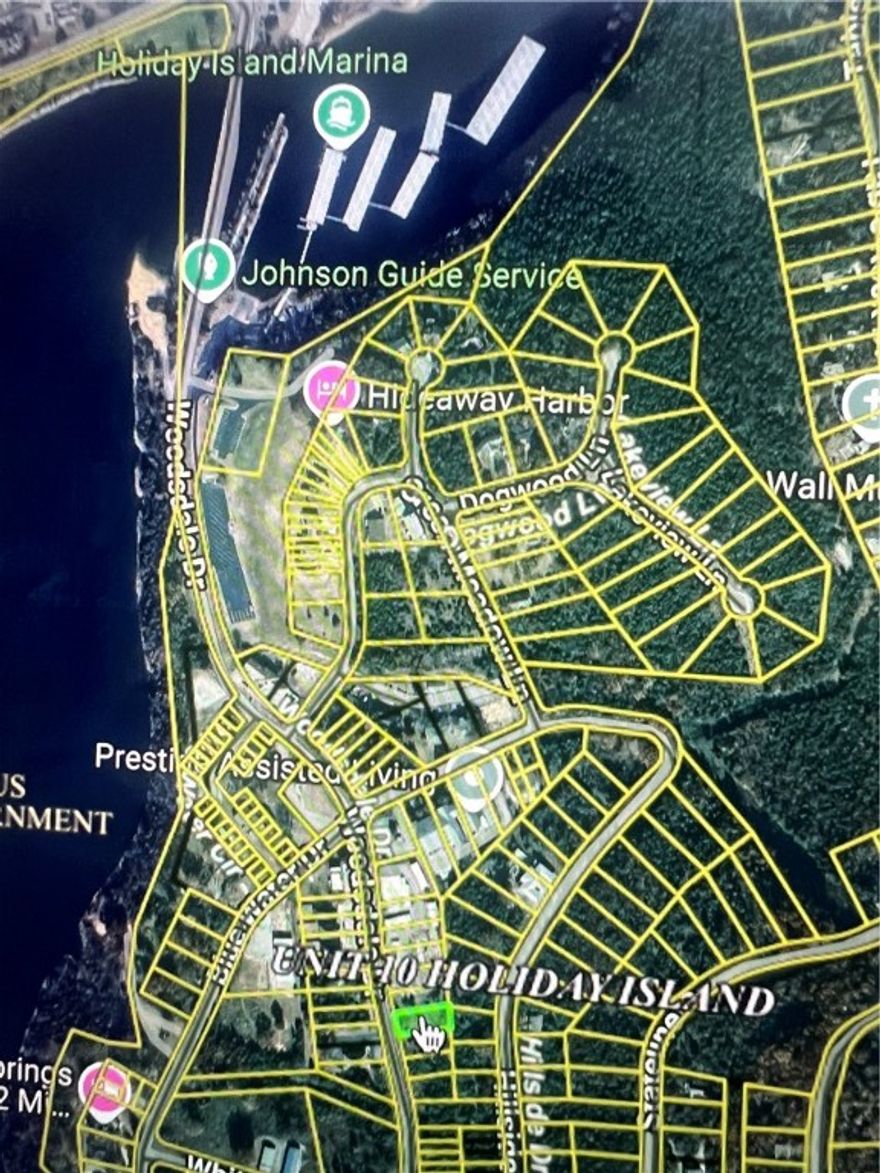 Flat Commercial Lot .4 Miles from Holiday Island Marina! Excellent Lot on the Island of Table Rock Lake with Main Road Frontage!! All Utilities at the street.  From Watersport Rentals, Boat Sales and Maintenance to IceCream Shop, endless opportunity with this one.  Owner Financing available and Contractor Concierge Service provided to get your idea through the permitting process so you can stay focused on your new business.  Leatherwood Trail and Holiday Island Beach and Kayak Park across the street!  This sleepy town is waking up and has never been easier to build than now. 2 Swimming Pools, Pickle Ball, Shuffle Board and 1 of 2 Golf Courses all within walking distance, ~1 mile.  Holiday island offers Resort Recreation Lifestyle Living and is a true Gem of the Ozarks.