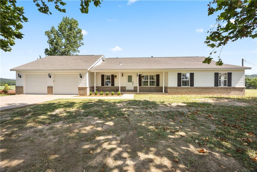 Looking for the country life? Beautiful country home on 38.353 +/- acres with Illinois River frontage. Newly drilled well services home and outbuildings and watering systems in places for livestock. Barn is 5340 sq ft, horse stalls, and small animal pens. Spacious updated 3-bedroom, 2 full bath house with new appliances, granite counter tops, fresh paint, new flooring in living area and bedrooms. Garage is heated and cooled with 8-foot garage doors, new garage door openers, includes a 50-amp outlet, wall to wall custom cabinets, and lots of attic storage. This property is move in ready!  
The property recently yielded approximately 180 round bales of hay. Ready for your dream hobby farm.