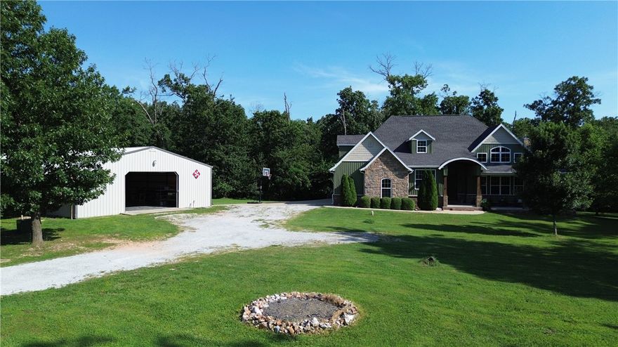 Welcome to your dream retreat! Nestled on 10+ serene acres, this stunning property offers the perfect blend of privacy, functionality, and proximity to all that Northwest Arkansas has to offer. The home features beautiful hardwood floors throughout and a smart, spacious layout with 3 bedrooms, 2 bathrooms, a dedicated office, and a versatile bonus room—ideal for modern living.

Step outside to enjoy the incredible 40x80 dream shop, fully equipped with electric, plumbing, and even a half bath—perfect for hobbies, storage, or running a business. The picturesque country setting offers peace and quiet, while still being just minutes from town. Imagine relaxing on the expansive front porch, soaking in the views and the tranquility of your own private paradise.