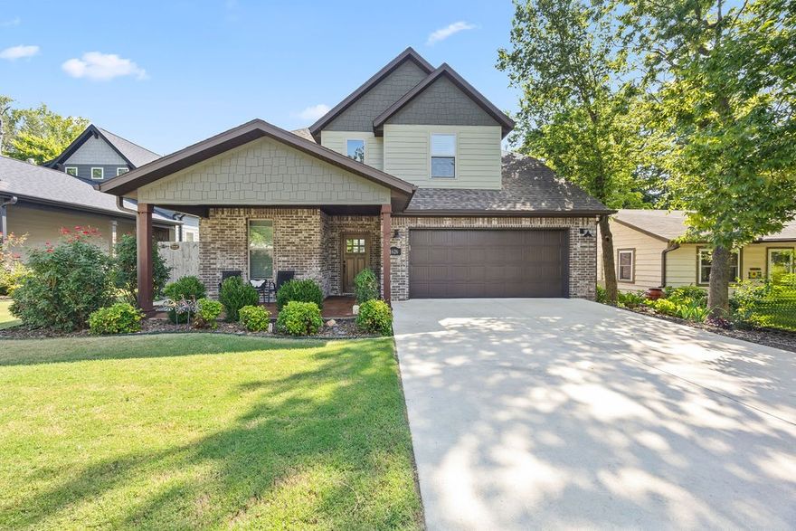 Modern elegance in Parksdale Subdivision! Stunning home offers warm ambiance throughout. Impressive living area w/ vaulted ceilings, wood beam accents and flows seamlessly into gourmet kitchen w/ granite countertops, ss appliances, tiled backsplash, center island, and pantry w/ stylish barn door. Main-level primary suite is complete w/ wood beams & custom tile shower. Spacious bedrooms all hav walk-in closets w/ thoughtfully designed built-ins. Quiet moments on back porch, watching lightning bugs drift by. Large cedar plank fencing & outbuilding has electricity. Custom bridge across a Beaver Lake watershed creek. Enjoy benefits of solar energy w/ panels, fully paid off & inc in the price. Enjoy approx $170 monthly in energy savings, offering immediate value and lower utility costs from day one. Just 3 mins to University of Arkansas, 1/2 block to Greathouse Park & Greenway, and easy access to I49 & 71B. Friendly & welcoming neighbors, truly feels like home. This is more than a place to live, it is a place to belong!