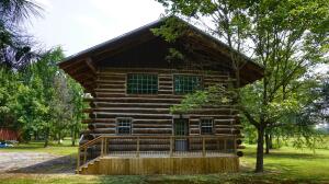 Crafted utilizing the Skip Ellsworth ''Butt & Pass'' system is how this UNIQUE and TRUE log home came alive. The art of the home started 16 years ago with the logs being harvested North of Atkins, transported and then stacked with the old world style of the pulley system - Logs placed one by one, hundreds of pieces of thick rebar and bolts, and countless amounts of concrete - the vision is coming to life! Fast forward to the end of 2019...It is now time to finish what was started. Housed with all of today's creature comforts, this home features 1575 SF, a brand new roof, three generous sun filled rooms (master on the bottom), two fully equipped baths, a spacious & open kitchen/living area and a front porch made for sittin' all while situated on one acre. Interested yet??