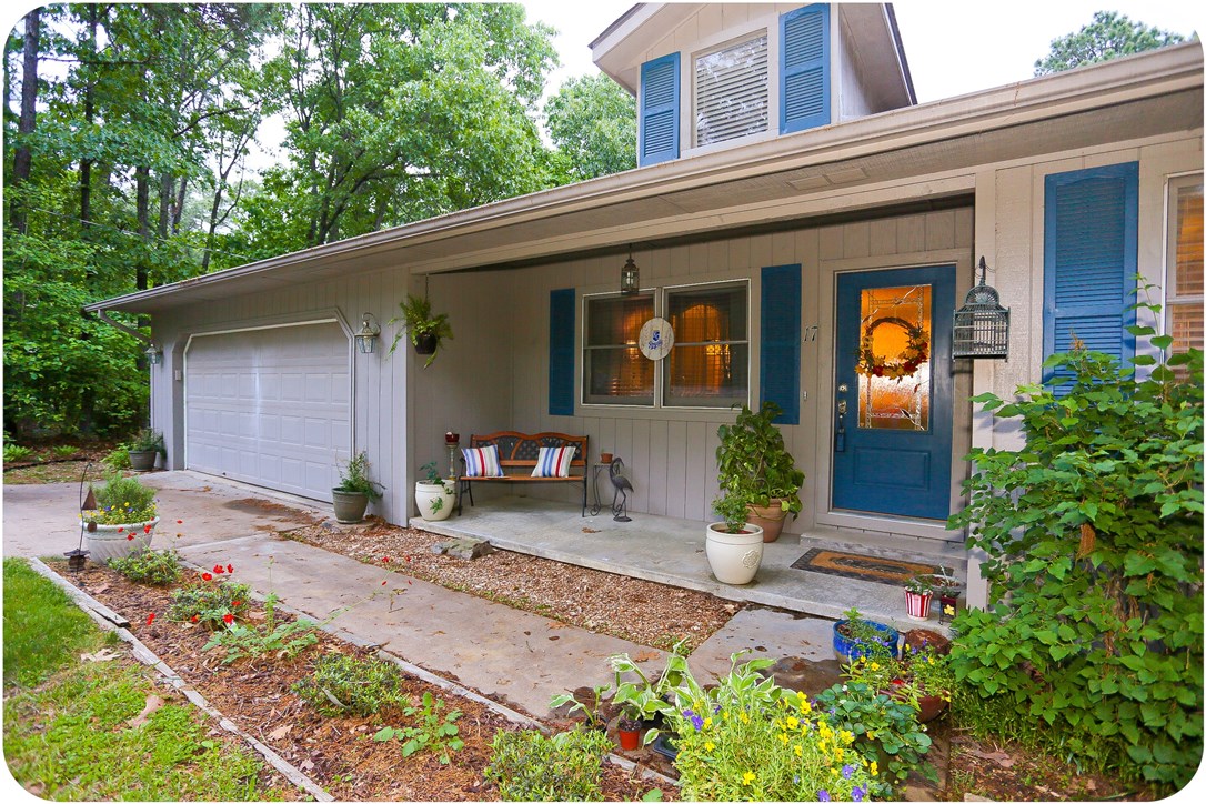 Adorable starter home with excellent privacy! One owner in a beautiful neighborhood. Wood windows, deck, lower storage room, gas logs in family room, screen covered sunroom, 1 mile from town center! New roof, new hot water heater, new kitchen countertops and appliances, new laminate flooring and carpet, new front door, sealed patio and deck--perfect for summer!