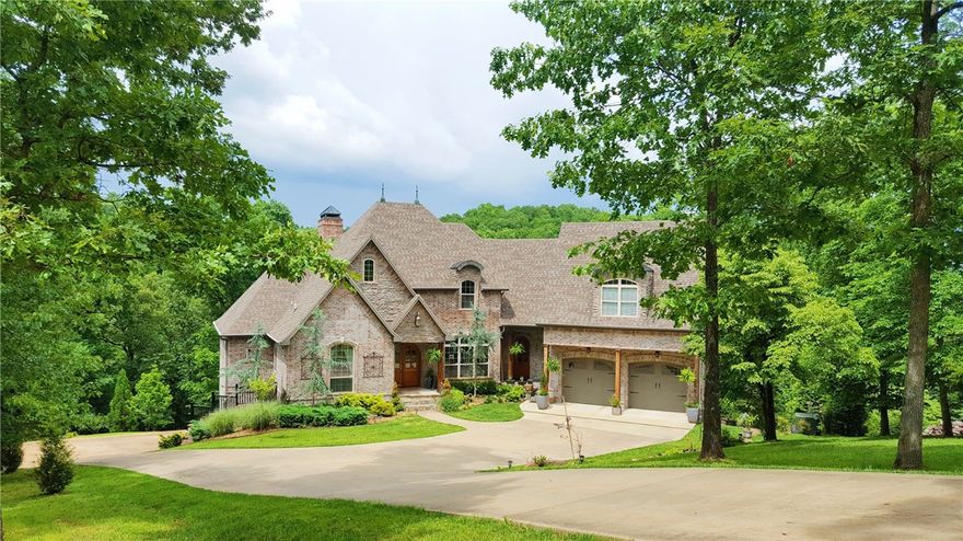 Exquisite lake front villa w/ private boat dock, french country home accented w/copper & stone, 3 levels overlooking lake, newly refinished beautiful wood floors, soaring ceilings, truly gourmet kitchen w/stainless, jenn air appliances, library, study, wine cellar, turrets in master suite, covered Veranda. 3 car garage. it has a beautiful pool with a waterfall and private path down to the lake with private boat dock