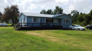 Bring your horse! Three bed, 2 bath, office, hardwood floors, over three acres, shop/man cave, mountain view, metal roof, decks, large apple tree, new windows, new kitchen appliances, and a great location less than 10 minutes from town! Better look quick!