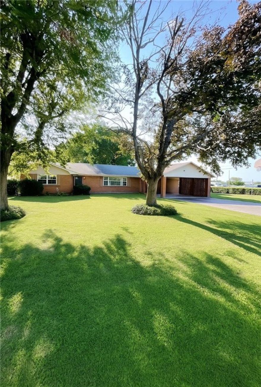 One Owner Home - First Time Listed for Sale in 62 Years! Well maintained, close to schools, downtown shopping district and restaurants. This 2,100 SF home features 3BR/2BA, expansive den w/fireplace, formal living room, huge eat in kitchen, extra-large storage room w/walk-in closet, a shelf closet and plenty of room for freezers. Outside is an oasis within itself! Mature trees, mature landscaping, concrete patio and a regulation size basketball goal. All of this on an almost 1/2 Acre level lot (.452 +/-)