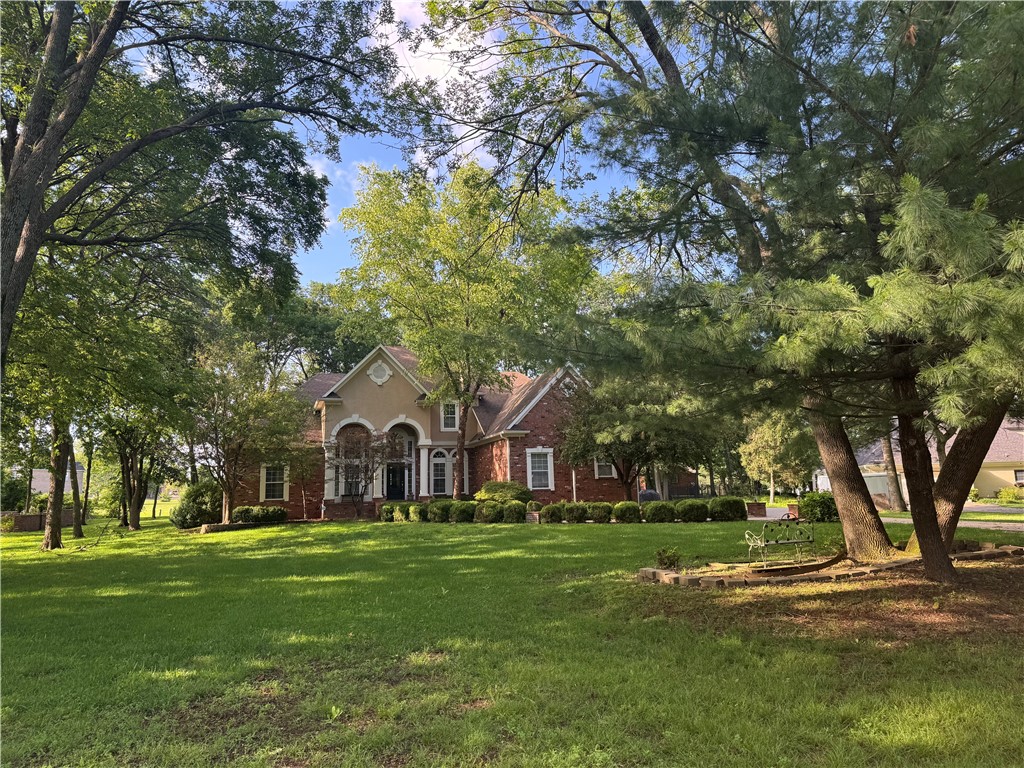 Elegant 4-bd, 4-bath residence offering 4,200 +/-?sq? ft of refined living space on a beautifully landscaped 0.98-acre lot. Custom built w/ prem features & updates, this home is located in a coveted subdiv in Siloam Springs, within walking distance to JBU, Bob Henry Park, & downtown. Every detail has been thoughtfully updated for modern comfort while preserving timeless style. Highlights incl: Grand 2-story foyer; *Bright, open concept living & dining areas w/ fresh interior paint & refinished hardwoods; *Gourmet kitchen feat natural-finish hardwood floors, walk-in pantry, & spacious island; *Primary suite on main level w/ spa-inspired bathroom incl a steam shower;*Flex layout w/ double Primary bedrooms or Primary w/ adjoining nursery for versatility; 3 generously sized secondary bdrms upstairs; Billiards room & a home theater or fitness room!-Step outside to an expansive backyard-an entertainer’s paradise w/ custom fire pit in a park-like setting, mature shade trees, & plenty of space for a future pool or garden.