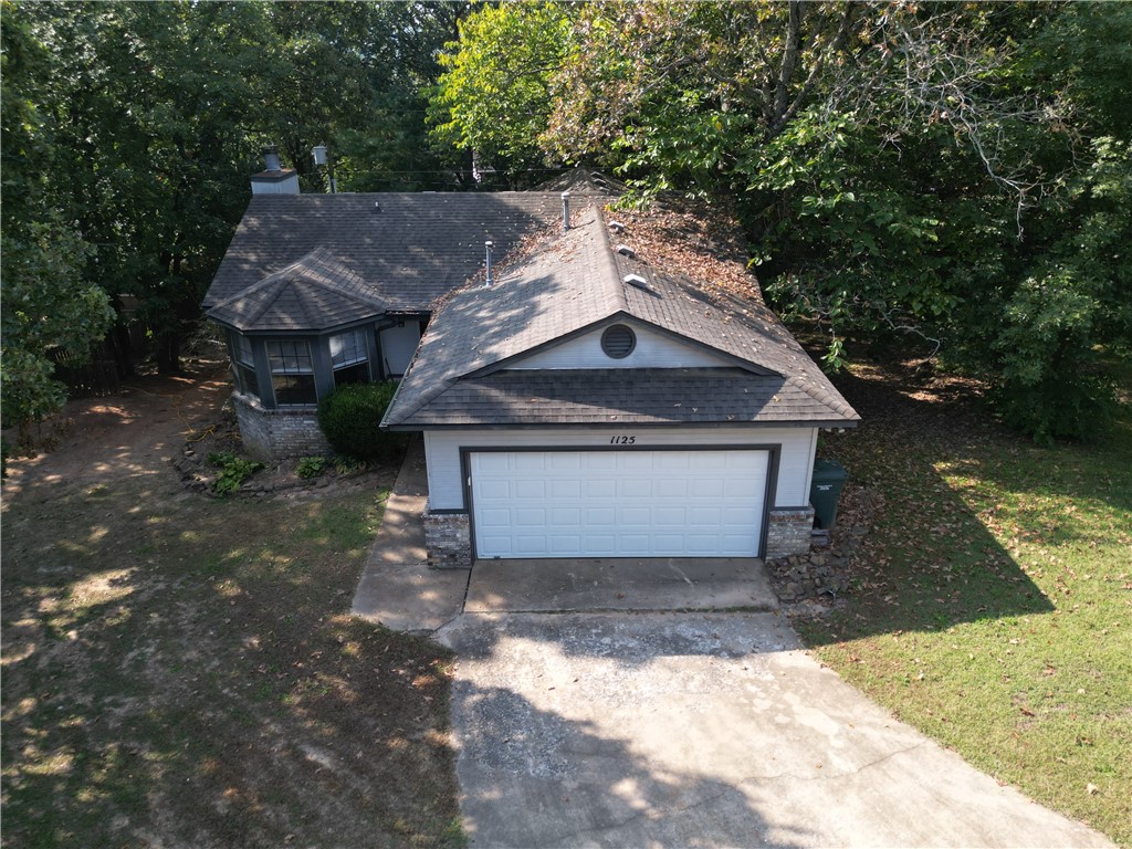 Welcome to this charming three bedroom on 1125 E Township St in East Fayetteville! This three bedroom two bath home is walking distance to Gulley Park and minutes from the University of Arkansas and the Fayetteville Square. New HVAC installed in 10/23 and a New Deck in 2025! Root Elementary, McNair Middle School, Woodland Junior High school district. Previously used as a rental property. Backyard is fenced with mature trees. Listing agent is related to Seller