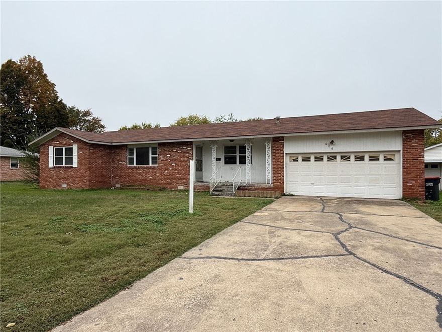Nice home near downtown Springdale. Home features 3 bedrooms, 1.5 bathrooms, new vinyl wood flooring throughout, nice oversized attached 2 car garage and separate 2-car garage along with outbuilding in backyard, covered front porch, covered back patio, all appliances, fenced yard, and almost 1/2 acre lot!