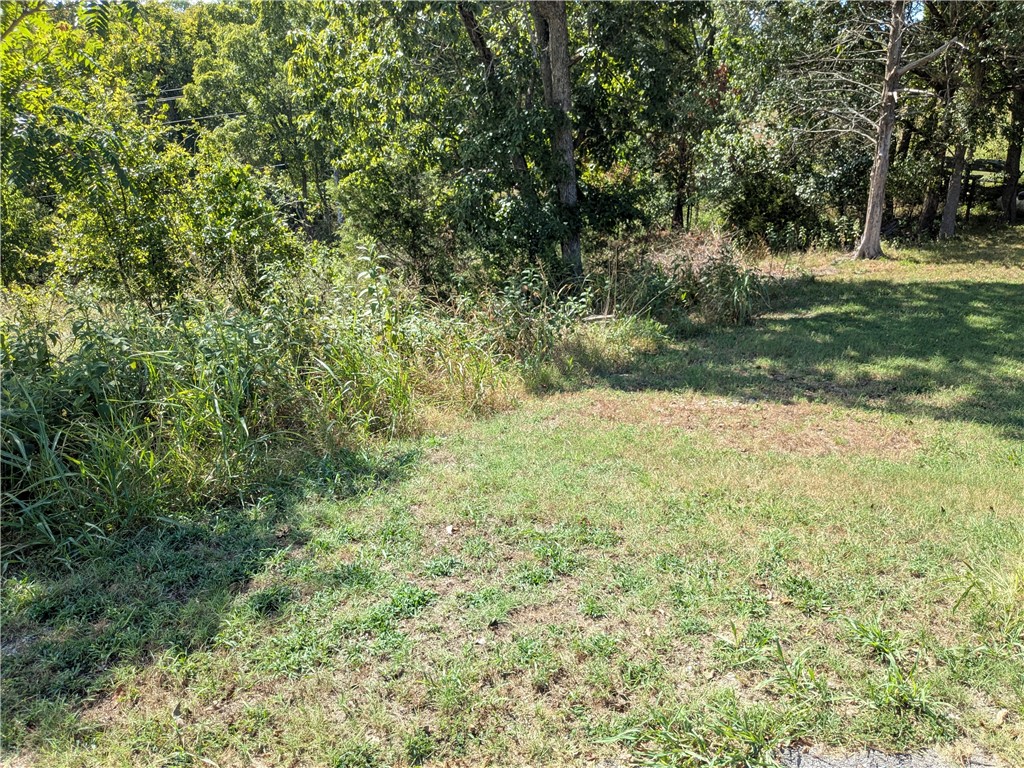 Ready for your dream home? This lot is a block from the Holiday Island Recreation Center and a short walk to the water. Quiet and gently wooded within a neighborhood, this lot offers the best of both worlds. Enjoy the amenities in Holiday Island like golf courses, a country club, swimming, tennis and a marina with a fishing dock or watch the local fauna from your front porch! Nearby Eureka Springs or Rogers offers great shopping and vibrant cultural hubs.