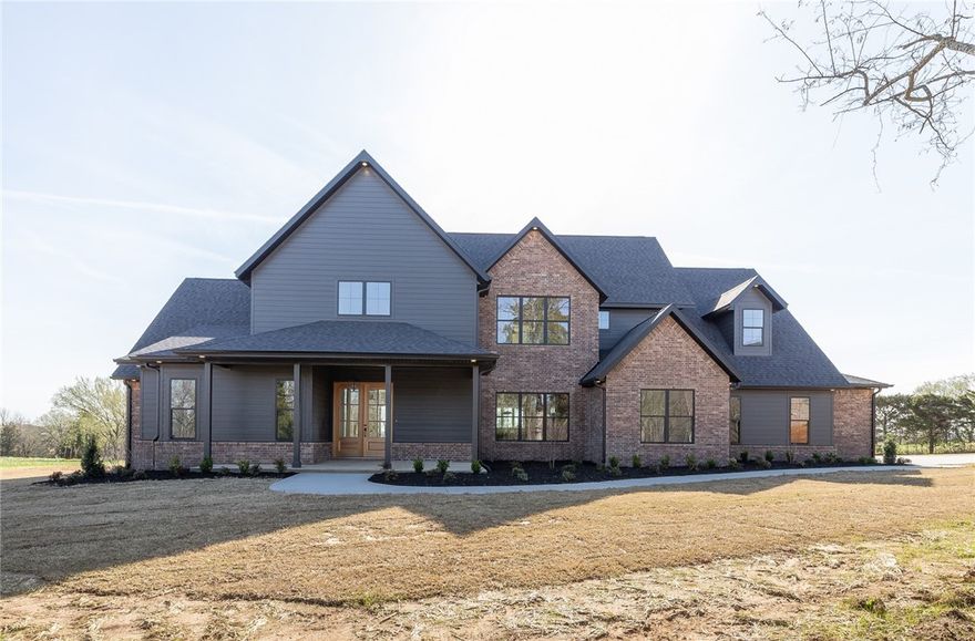 A beautifully appointed NEW CONSTRUCTION home in East Fayetteville!  Situated on 1.68 acres this home offers 4,025 heated sq ft, 5 bedrooms, 4 full bathrooms, 1 half bathroom, open eat in kitchen to living, an amazing butler’s pantry, study, bonus/theater room, and separate laundry.  Amenities include professional series induction range, pot filler, double ovens, quartzite counter tops, hardwood floors, 10’ ceilings on the main level, 8’ doors, blown insulation, cat 6 plugs throughout, large covered patio, and a 3 car garage.  2 bedrooms are on the main level as well as the study!  Upstairs offers 3 more bedrooms, the bonus, and a perfect loft with built ins!  This home was built with an incredible attention to detail and is MOVE IN READY. Zoned for Fayetteville Schools.