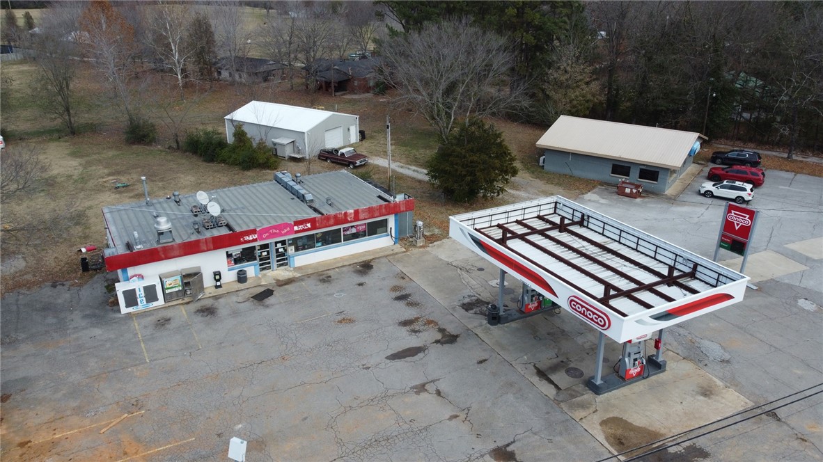 Investor Alert! C-Store & Gas Station on Nearly 1 Acre with Prime Hwy Frontage! An opportunity you don’t want to miss — this vacant gas station and convenience store is a hidden gem with serious potential! Locals may remember this nostalgic spot from years past, and now it’s ready for a fresh start. Located on a high-traffic stretch between Fayetteville and Elkins, this property sits on nearly 1 acre of commercial land with excellent visibility and frontage. Sold - as is -where is. Information is deemed reliable, but not guaranteed.