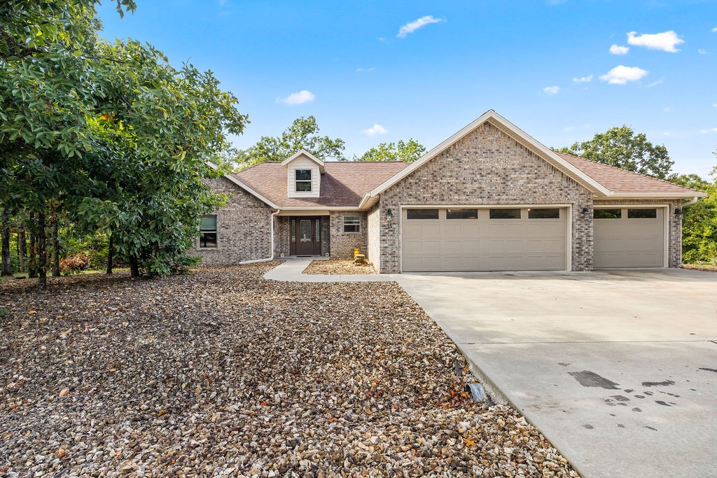 Gorgeous three-bedroom, two-bathroom home featuring a split floor plan and LVP flooring throughout. The spacious hobby bedroom boasts a vaulted ceiling and walk-in closet, while the kitchen and bathroom cabinets are crafted from real wood. Triple-paned windows and a water circulator at the hot water heater provide comfort and efficiency. Three car garage with plenty of parking space and an extra wide 22 foot garage door. Step outside to enjoy a screened-in, beautiful porch, perfect for relaxing or entertaining year-round, overlooking a low-maintenance yard that adds ease to your lifestyle. Additional updates include a new roof in 2021 with warranty and landscape lighting that enhances the homeās curb appeal. Situated on a level lot with tons of parking. Conveniently located down the street from Branchwood Recreation Center, with quick access to all that Bella Vista has to offer!!