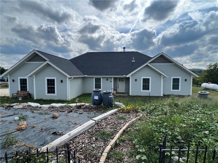 Great Ozark Mountain homesteaders mini farm.  Come check out this 5 BR, 3.5 BA, 2,141 SQFT, 2 car garage, and 6.71 acres m/l.  The home features granite countertops, wood fireplace, wood stove location, walk-in closet, pantry, and much more.  The land is all in fenced pasture for livestock and has a 30’ x 40’ metal shop with concrete floor and electric.  Call today to schedule a showing.