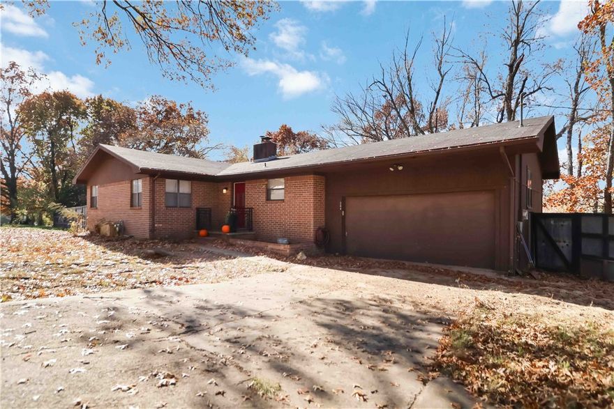 Discover the charm and comfort of this welcoming 3BR/2BA home situated on a spacious lot in Prairie Grove. The home features a bright, open living, kitchen, and dining layout that creates an easy flow and a warm, connected feel throughout. The backyard is a true highlight—offering generous space to relax, play, garden, or design the outdoor retreat you’ve been envisioning. Thoughtful touches set this property apart, including a custom built-in dog watering station that pet lovers will appreciate. Conveniently located just 0.4 miles from Hwy 62 and 0.5 miles from Prairie Grove Battlefield State Park, you’ll enjoy quick access to trails, parks, and everyday amenities. Blending inviting spaces, practical upgrades, and a great location, this home offers comfort, convenience, and a setting that’s easy to love